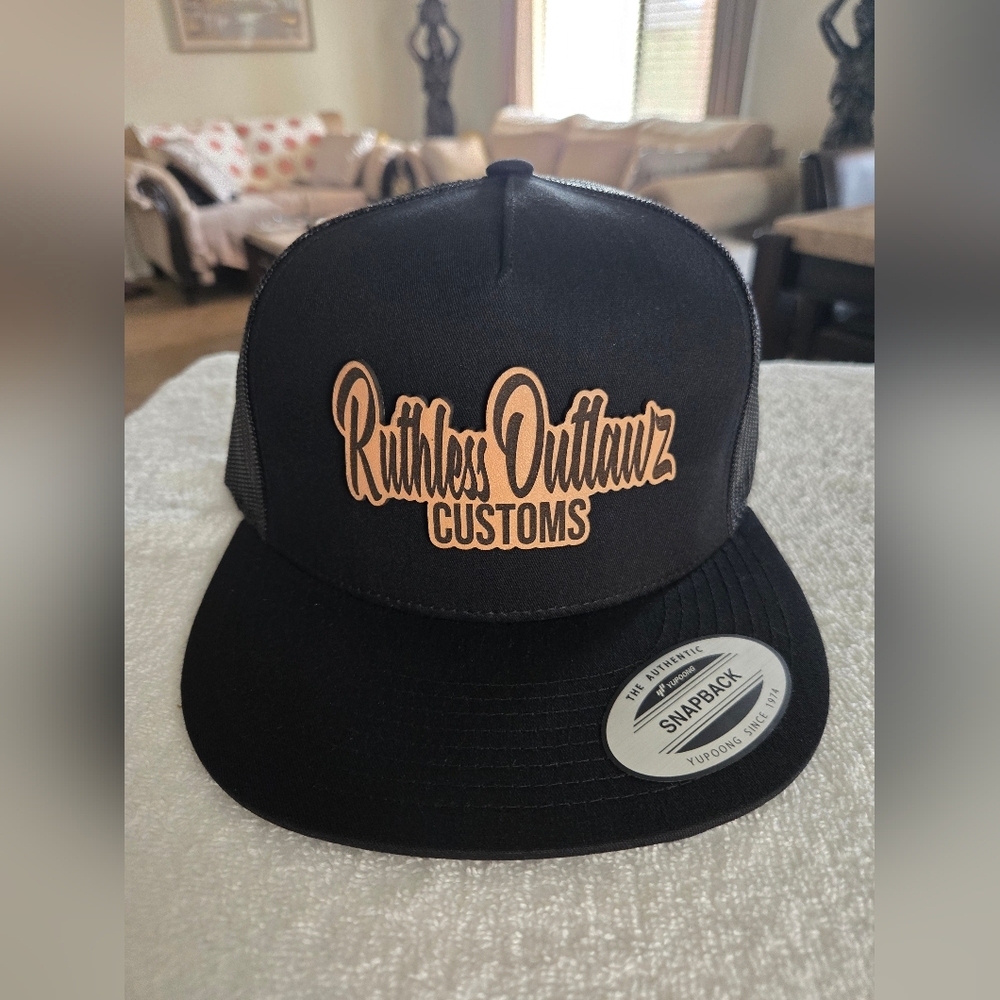 RUTHLESS OUTLAWZ CUSTOMS  LEATHER PATCH  CAP.      (5 PANEL  FLAT CAP)